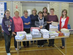 Magheragall parishioners with some of the shoe boxes ready to go to India.